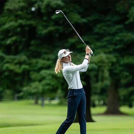golfer-swinging-a-club-on-the-course